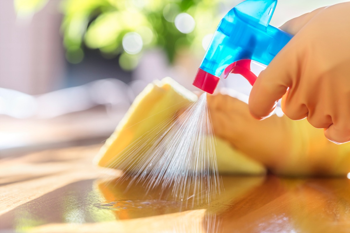 cleaning-with-spray-detergent-rubber-gloves-and-dish-cloth-on-work-picture-id1202033073.jpg